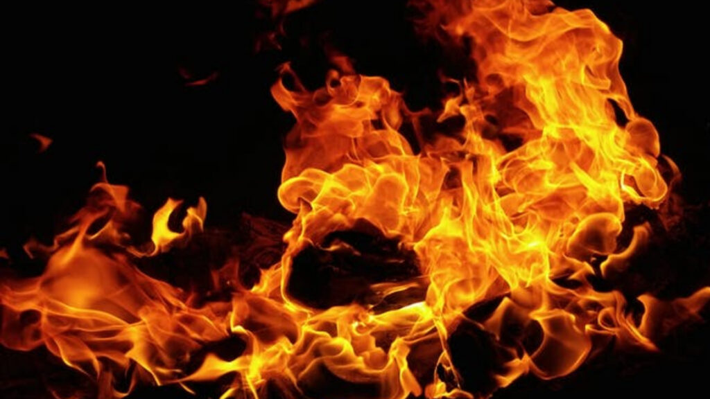 How Often Should Landlords in London Conduct Fire Risk Assessments? 1 Commercial fire risk assessment London being conducted at a business premises with a safety expert inspecting fire equipment.